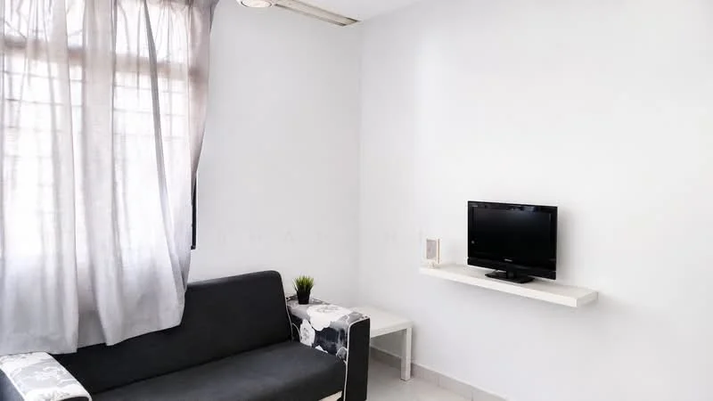 Living features: grey fabric sofa, wall-mounted TV, white wall, light grey curtains, white shelf, small decorative plant, tile flooring, ceiling light fixture; style: modern.