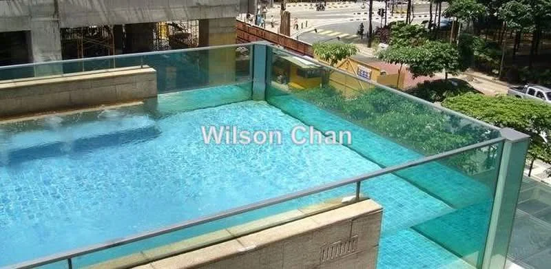 Exterior type: high-rise condominium; features: infinity pool, glass railing, pool deck, surrounding greenery, urban view, water feature, tile flooring around pool; style: modern.