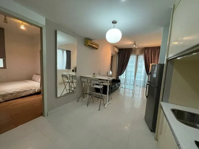 Living features: white painted walls, white tiled flooring, recessed downlights, 1 ceiling-mounted pendant light, floor-to-ceiling windows, sheer curtains, dining table for 4, 4 white chairs, air conditioning unit, mirror on wall, sliding glass door leading to balcony; style: modern. Bedroom features: white painted walls, wood flooring, queen-size bed, bedding, bedside table, table lamp, window with sheer curtains; style: modern.