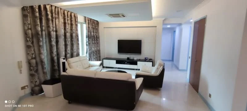 Living features: cream leather sofa, black leather sofa, coffee table, wall-mounted TV, TV console, recessed ceiling lights, white painted walls, cream tiled flooring, floor-to-ceiling windows with sheer curtains, decorative wall panel, air conditioning unit; style: modern.