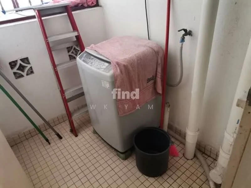 Laundry features: top-load washing machine, pink towel draped over washing machine, tiled flooring, white walls, red ladder, green cleaning broom, black bucket, white plumbing pipes.