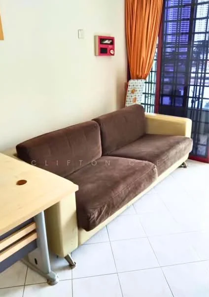 Living features: 3-seater fabric sofa in brown, light-coloured armrests, wooden side table, white tiled flooring, orange curtains, wall-mounted decorative item, large window with grid pattern, neutral wall colour; style: modern.
