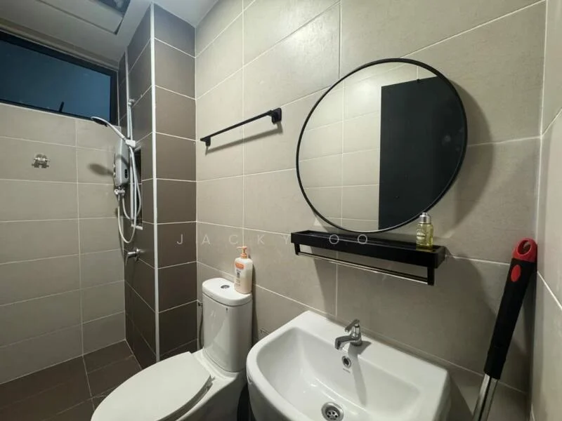 Bathroom features: white tiled walls, dark grey accent wall, ceramic tile flooring, round mirror, wall-mounted shelf, single-sink vanity, chrome basin mixer faucet, one-piece toilet, shower with handheld showerhead, wall-mounted shower control, soap dispenser, toilet paper holder; style: modern.