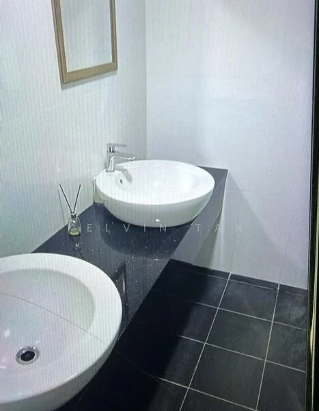 Bathroom features: white round basin sink, chrome faucet, black countertop, black tile flooring, white painted walls, framed mirror, decorative reed diffuser; style: modern.
