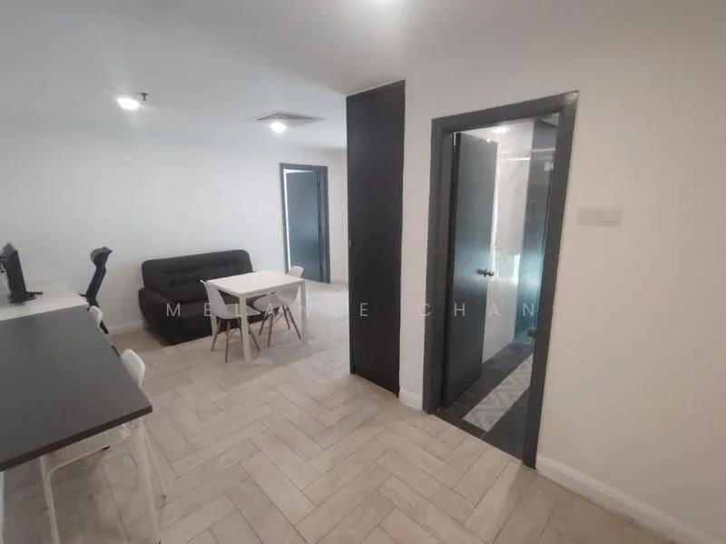 Room features: light grey painted walls, herringbone patterned tile flooring, black door frame, white ceiling, recessed downlights, black accent wall, white dining table with four chairs, black 3-seater sofa, open layout, doorway leading to bathroom, doorway leading to another room; style: modern.