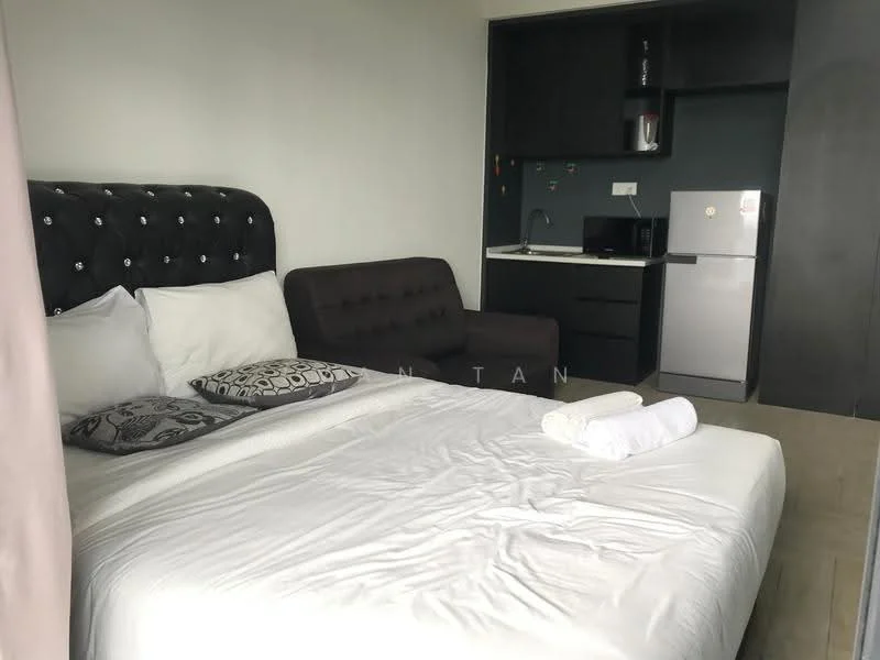 Bedroom features: king-size bed with upholstered headboard, white bedding, 2 decorative pillows, sofa in dark brown fabric, kitchenette with sink, black cabinetry, white fridge, wall-mounted kitchen shelf, grey accent wall, tile flooring; style: modern.