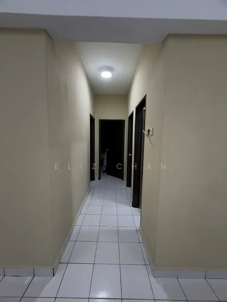 Hallway features: cream painted walls, white tiled flooring, ceiling light fixture, door frames in dark wood, two doorways leading to rooms, straight corridor layout.