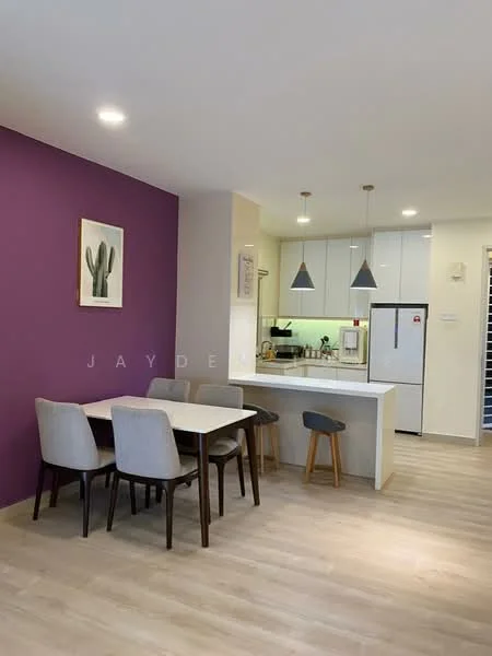 Dining features: 4-seater dining table, grey upholstered dining chairs, purple accent wall, light wood flooring, recessed downlights, pendant lights above countertop, open-plan layout to kitchen, wall-mounted artwork; style: modern. Kitchen features: white cabinetry, stainless-steel appliances, built-in oven, microwave, kitchen island with seating, light green backsplash, countertop with bar stools, under-cabinet lighting; style: modern.