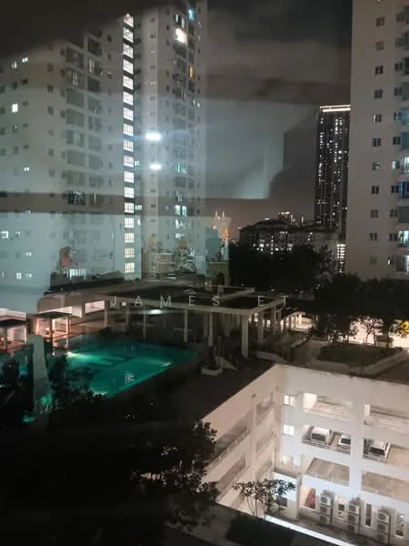 Exterior type: high-rise condominium; features: swimming pool, pool deck with loungers, landscaped garden, multiple floors visible, city skyline in background, outdoor seating area, illuminated building facade, covered parking area; style: modern.