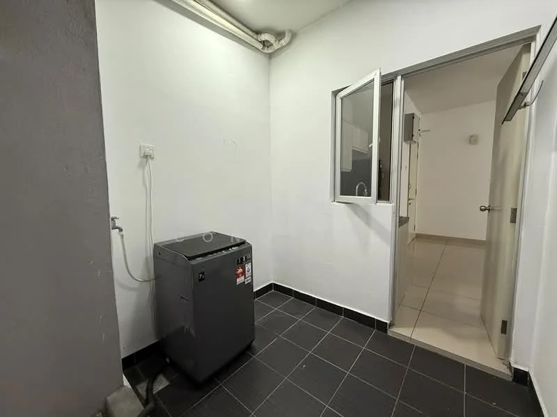 Laundry features: front-load washing machine in grey, black tiled flooring, white painted walls, window for natural light, plumbing connection, door leading to another room.