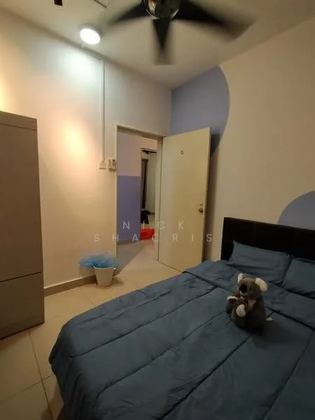 Bedroom features: queen-size bed with blue bedding, upholstered headboard, ceiling fan, light blue accent wall, white painted walls, tile flooring, built-in wardrobe, door leading to another room, waste bin, stuffed toy on bed; style: modern.