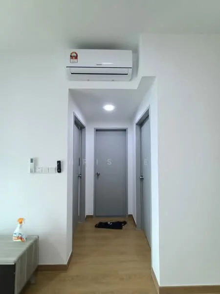 Hallway features: light wood flooring, white painted walls, 1 wall-mounted split AC, recessed ceiling light, 3 grey doors, intercom panel, cleaning spray bottle on table, grey door frames; style: modern.