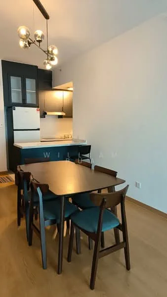 Dining features: 4-seater dining table, wooden dining chairs with teal upholstery, pendant light fixture with multiple bulbs, laminate flooring, white painted walls, open kitchen layout, refrigerator visible in background, kitchen cabinetry in dark color; style: modern.