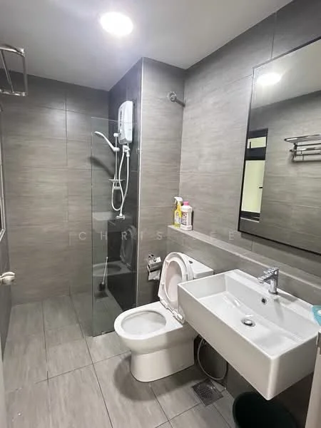 Bathroom features: grey tiled walls, grey tiled flooring, walk-in shower with glass enclosure, rain shower head, handheld shower, single-sink vanity with white cabinet, chrome basin mixer faucet, framed mirror, one-piece toilet, towel rack, shower wall-mounted water heater; style: modern.
