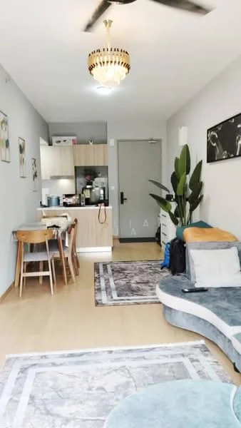Living features: light wood flooring, grey painted walls, chandelier light fixture, 5-blade ceiling fan, sofa with curved design in grey, area rug with marble pattern, decorative wall art, potted plant, dining table with 4 wooden chairs, open kitchen with cabinetry, kitchen appliances visible, door leading to hallway; style: modern.