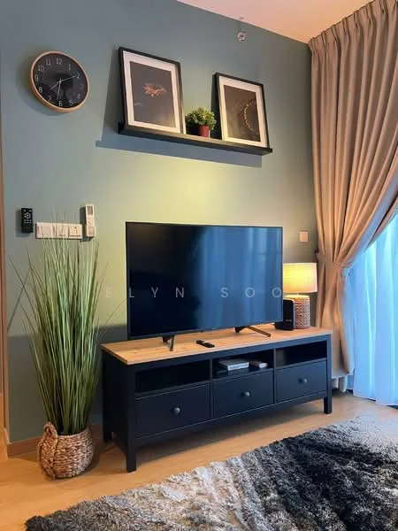 Living features: light blue painted walls, wooden flooring, floor-to-ceiling windows with sheer curtains, black TV console, large flat-screen TV, decorative wall clock, framed artwork on wall, shelf with potted plant, table lamp, decorative plant in woven basket, area rug with geometric pattern; style: modern.