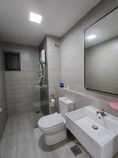 Bathroom features: grey tiled walls, light grey tiled flooring, walk-in shower with glass enclosure, rain shower head, handheld shower, white wall-mounted toilet, single-sink vanity with white cabinet, chrome basin mixer faucet, large framed mirror, toilet paper holder, soap dispenser, shower heater, window for natural light; style: modern.