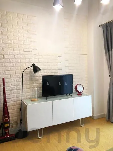 Living features: white painted walls, exposed brick accent wall, light wood flooring, TV console in white, black floor lamp, flat-screen TV, red wall clock, decorative items on console; style: modern.