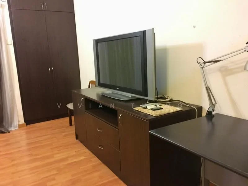 Room features: wooden flooring, dark wood TV console, large flat-screen TV, remote control on TV console, desk with lamp, dark wood wardrobe, chair, light-colored walls; style: modern.