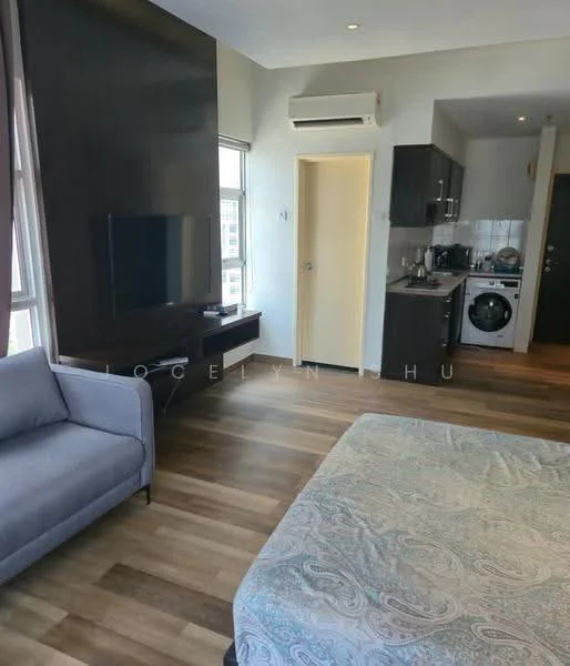 Room features: wooden flooring, wall-mounted TV, sofa in grey fabric, kitchenette with cabinets, built-in washing machine, refrigerator, white painted walls, air conditioning unit, door leading to hallway, window with natural light; style: modern; view: city.