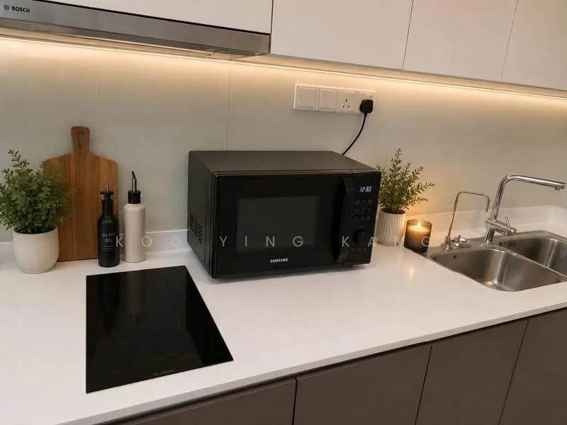 Kitchen features: black microwave, white countertop, stainless-steel sink, chrome pull-down faucet, induction cooktop, wooden cutting board, decorative plants in ceramic pots, black oil dispenser, black vinegar dispenser, candle, under-cabinet lighting; style: modern.