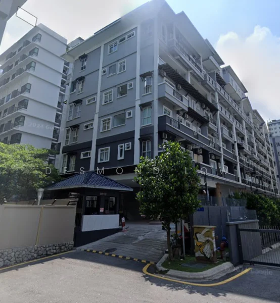 Exterior type: mid-rise condominium; features: grey painted facade, balconies with railings, multiple air conditioning units visible, landscaped entrance with trees, paved driveway, security gate at entrance, parking area, surrounded by greenery; style: modern.