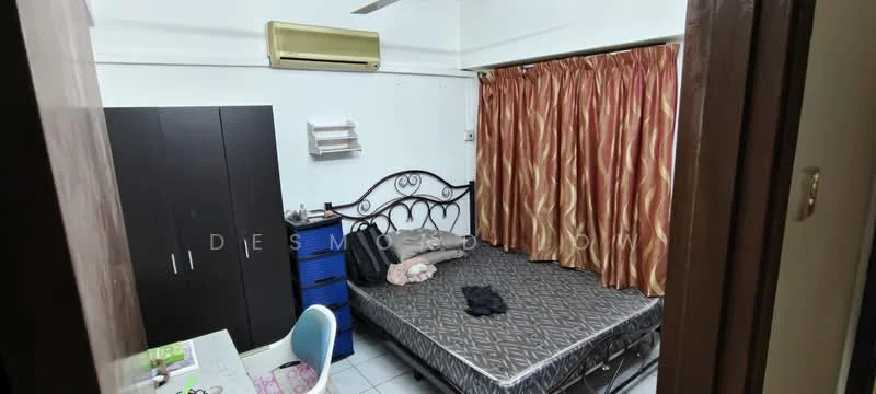 Bedroom features: queen-size bed, upholstered headboard, bedside lamp, built-in wardrobe, study desk, blue chair, air conditioning unit, curtains with a patterned design, tile flooring, wall-mounted shelving.