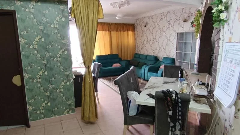 Living features: green fabric sofa set, area rug, wall-mounted ceiling fan, floral wallpaper, cream painted walls, curtains in yellow, dining table with marble top, grey upholstered dining chairs, decorative wall arch, floor tiles, window with glass panes; style: traditional. Room features: green floral wallpaper, doorway leading to another room, tile flooring.