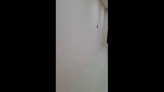 Room features: light pink painted walls, white tiled flooring.