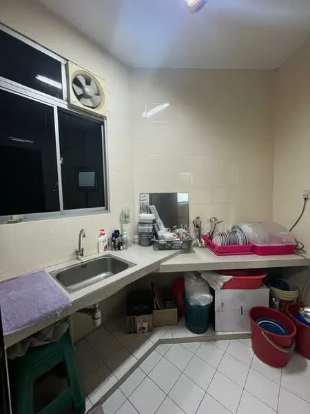 Laundry features: single-bowl stainless-steel sink, chrome faucet, white tiled walls, white tiled flooring, window with black frame, wall-mounted fan, countertop, plastic storage bins, stacked boxes, cleaning supplies, dish rack.