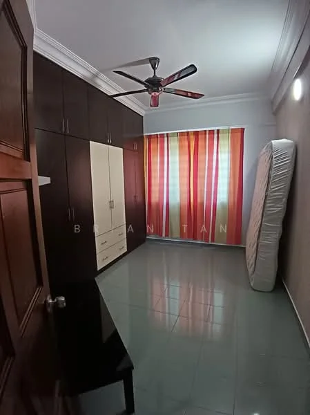 Bedroom features: green glossy floor tiles, white painted walls, crown moulding, built-in wardrobe with white and wood finish, ceiling fan with light, striped curtains in red, orange, and yellow, single mattress leaning against the wall, black desk, wall-mounted light fixture; style: modern.