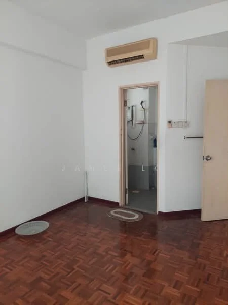 Room features: white painted walls, parquet wood flooring, wall-mounted split AC, door leading to bathroom, round area rug, circular floor drain, light switch, door frame.