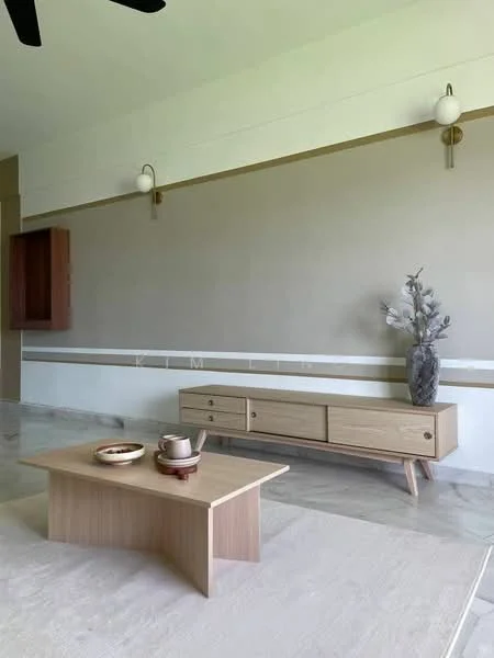 Living features: light beige painted walls, white ceiling, marble flooring, wooden coffee table, wooden TV console with drawers, decorative vase with foliage, wall-mounted sconces, neutral area rug; style: modern.