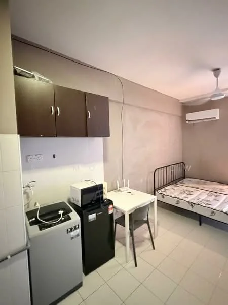 Room features: single bed frame without mattress, white walls, ceiling fan, window air conditioning unit, white tiled flooring, dark wood cabinetry, small dining table with two chairs, washing machine, black fridge, microwave, kitchenette with sink; style: modern.