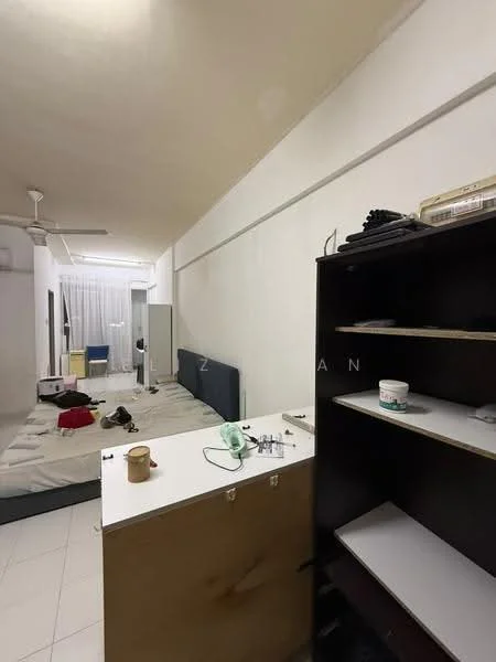 Room features: white painted walls, plain ceiling, tile flooring, ceiling fan, bed with mattress, bedside table, open shelving unit, window with sheer curtains, light-colored bedding, cluttered space, wall-mounted mirror; style: minimalist.