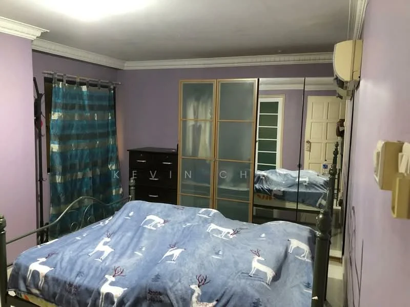 Bedroom features: purple painted walls, wooden flooring, queen-size bed with patterned blanket, mirrored wardrobe, black dresser, floor-to-ceiling mirror, curtains with blue and silver stripes, air conditioning unit, ceiling light fixture.