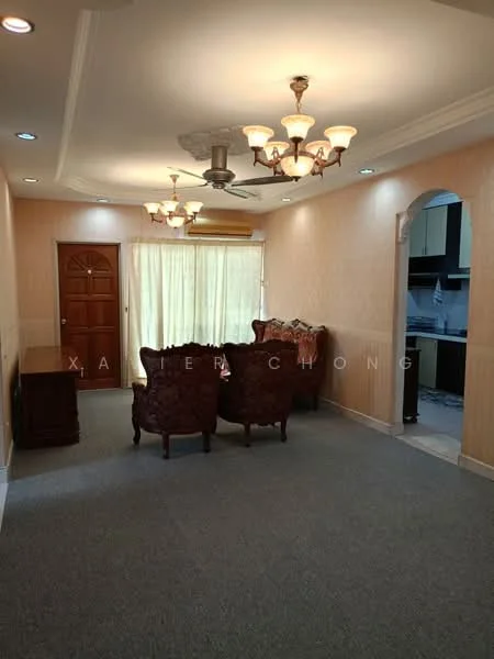 Living features: beige painted walls, carpet flooring, 5-blade ceiling fan with light, chandelier, arched doorway, large window with sheer curtains, wooden front door, upholstered armchairs, wooden side table; style: traditional.