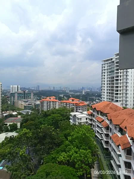 Exterior type: high-rise condominium; features: red tiled roof, glass curtain wall, surrounded by greenery, urban skyline view, multiple low-rise buildings, manicured landscaping, balconies visible, cloudy sky; style: modern.