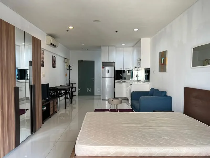 Living features: white painted walls, glossy tile flooring, recessed downlights, sofa in blue fabric, coffee table, wall-mounted TV, built-in wardrobe with mirrored doors, kitchenette with white cabinetry, stainless-steel fridge, kitchen countertop, dining table with two chairs, decorative artwork on walls; style: modern.