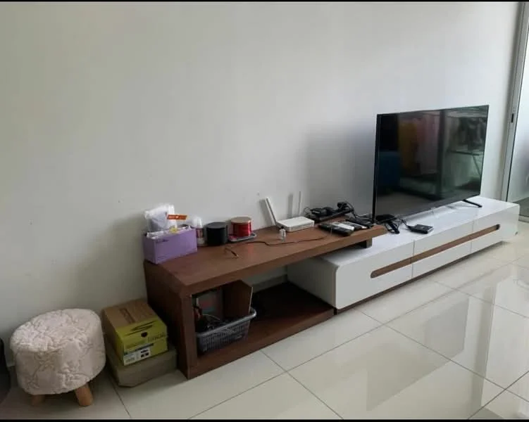 Living features: white painted walls, glossy tile flooring, wooden TV console, flat-screen TV, cable management, decorative storage boxes, wireless router, small round ottoman, various electronic cables, open shelving, neutral color palette; style: modern.