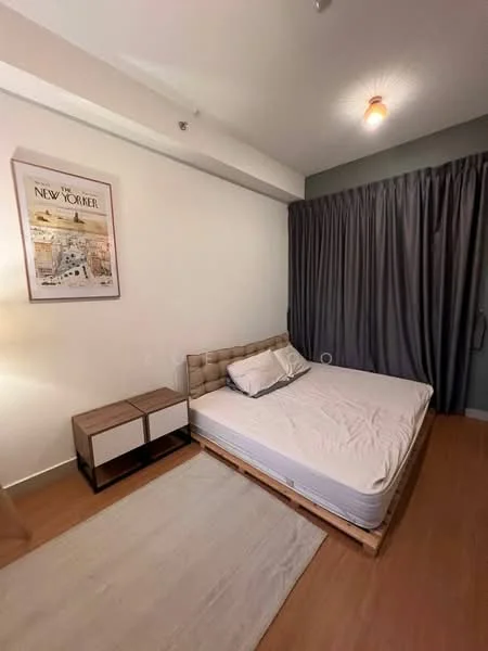 Bedroom features: queen-size bed, upholstered headboard, wooden bed frame, nightstand with drawers, framed artwork on wall, grey curtains, laminate flooring, ceiling light fixture; style: modern.
