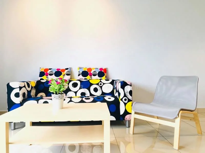 Living features: 3-seater fabric sofa with colorful polka dot pattern, 2 decorative cushions with polka dot pattern, light grey lounge chair, coffee table with light wood finish, potted plant on coffee table, glossy tile flooring, plain white walls, natural light from window; style: modern.