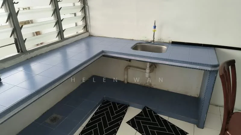 Room features: blue tiled countertop, stainless-steel sink, wall-mounted faucet, corner layout, white walls, black and white patterned mat, window with horizontal slats, floor drain.