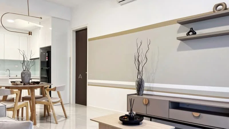 Living features: white painted walls, grey accent wall, polished tile flooring, ceiling-mounted light fixture, wall-mounted shelf, decorative vase on shelf, decorative branches in vase, TV console with drawers, coffee table, round dining table with wooden legs, upholstered chairs, refrigerator visible in kitchen area; style: modern.