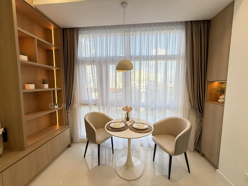 Dining features: round dining table, two upholstered dining chairs in cream, wooden shelving unit, white curtains, floor-to-ceiling windows, light pendant, decorative vase with flowers, wooden cabinetry, neutral wall colour, glossy tile flooring; style: modern; view: city.