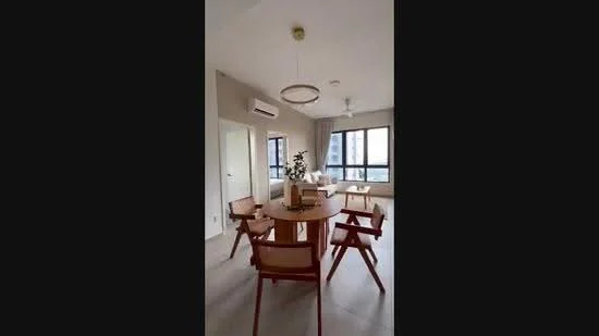 Dining features: round wooden dining table, 4 wooden dining chairs, pendant light fixture, wall-mounted split AC, floor-to-ceiling windows, curtains, light-colored walls, neutral tile flooring, decorative plant on table, ceiling fan; style: modern; view: city.