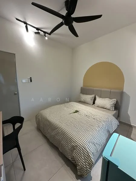 Bedroom features: king-size bed with checkered bedding, upholstered headboard, 2 bedside pillows, ceiling fan with 3 blades, track lighting, light grey painted walls, cream accent wall, tile flooring, small plant on bed, black dining chair, refrigerator in turquoise color, door to hallway; style: modern.