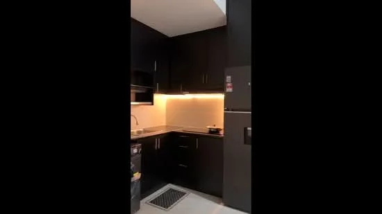 Kitchen features: black cabinetry, stainless-steel sink, chrome pull-down faucet, black countertop, built-in oven, stainless-steel fridge, ceramic tile flooring, recessed LED downlights, tile backsplash, ventilation grill; style: modern.