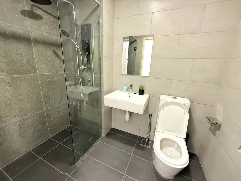 Bathroom features: walk-in shower with glass enclosure, rain shower head, handheld shower, single-sink vanity with wall-mounted faucet, mirror, one-piece toilet, grey tile flooring, grey tile walls, plant decoration, wall-mounted soap holder; style: modern.