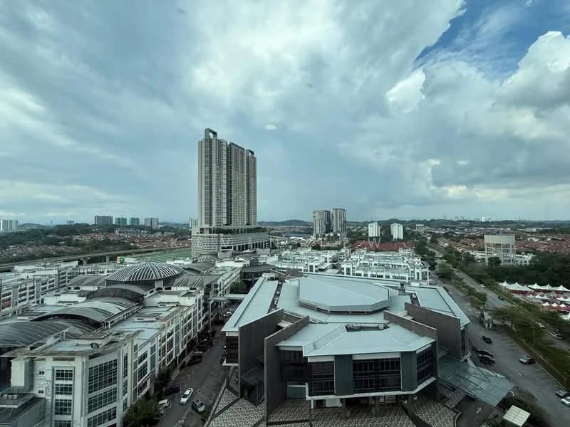 Exterior type: high-rise condominium; features: glass curtain wall, approximately 20-storey high-rise, surrounded by mature greenery, urban context with commercial buildings, manicured landscaping, view of city skyline, rooftop amenities visible, surrounding residential developments; style: modern.